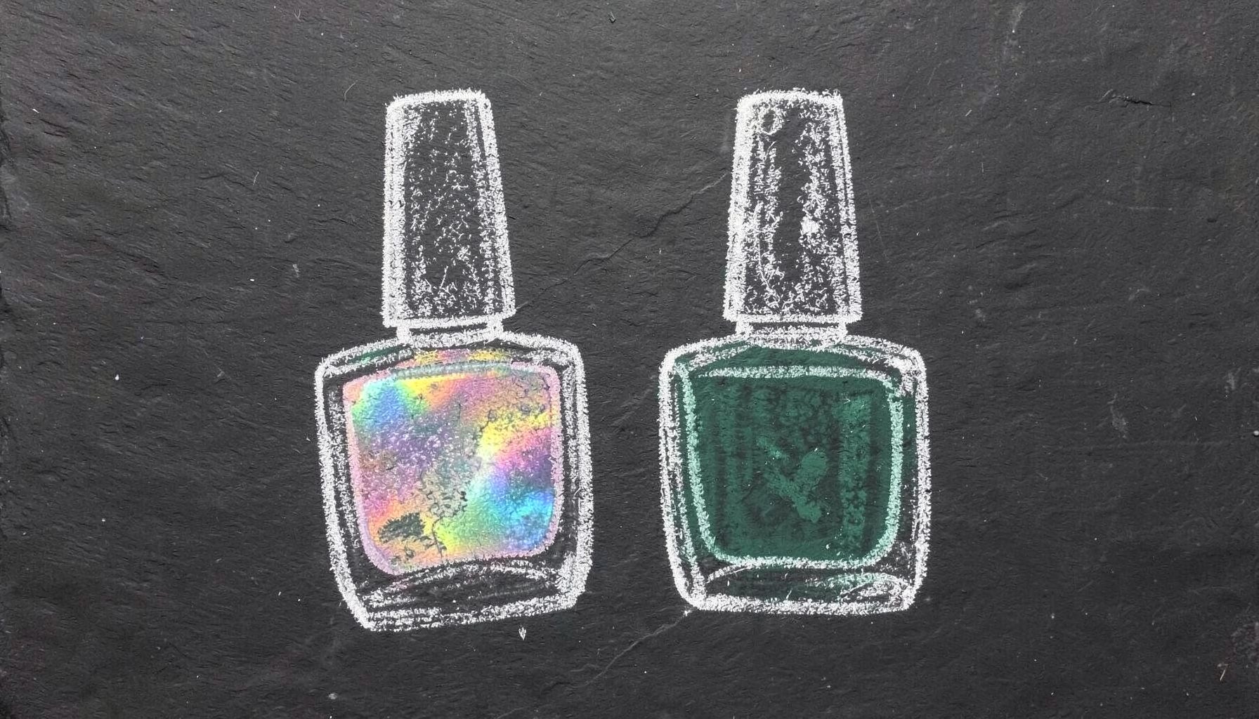A chalk drawing on a dark slate board of two nail polish bottles side by side, one with a holographic rainbow effect rendered in soft chalk smudges.