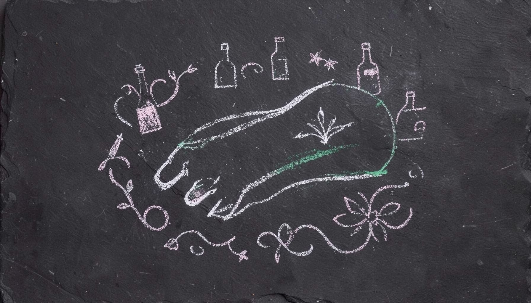 A chalk drawing on a dark slate board showing a graceful cat's paw with delicate curved claws, surrounded by tiny polish-bottle silhouettes and floral swirls in soft white and pale pink chalk lines against the deep charcoal-black slate.